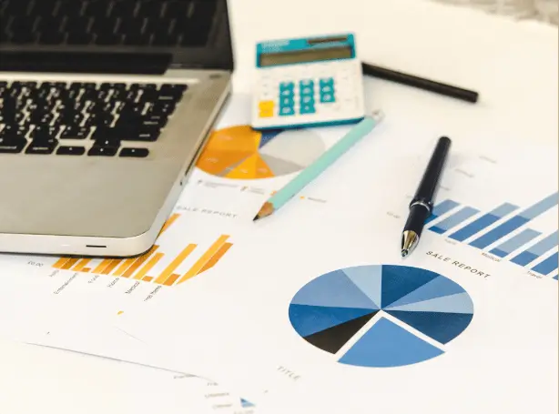 Brevo campaign report on a laptop with open and click rates showing steady email marketing growth